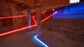 Walk on the Pressure plate. The pre-connected Connector opens the first Blue door. You can walk off the Pressure plate as the secondary red Emitter is also connected.